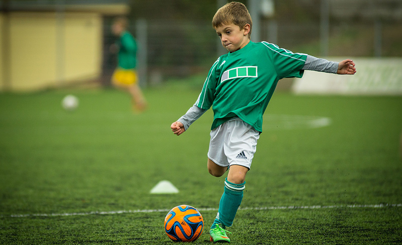 Boy playing soccer