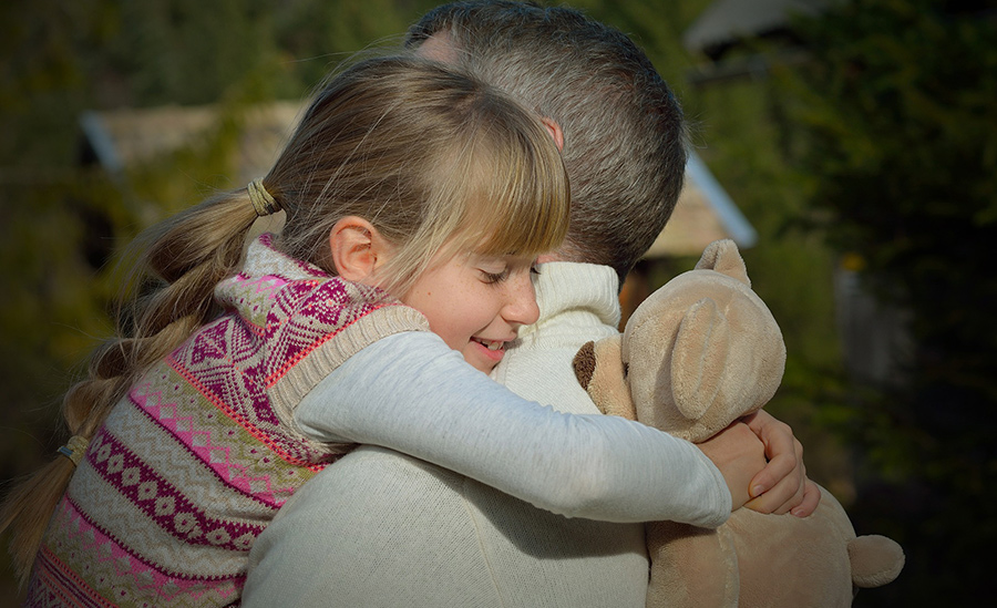 Girl hugging dad